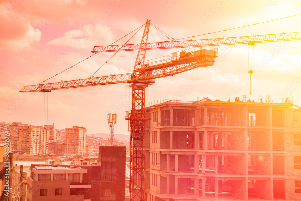 Construction cranes work Construction cranes work
