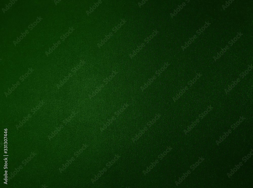 Green metallic textured background with a gradient. Green metallic textured background with a gradient.
