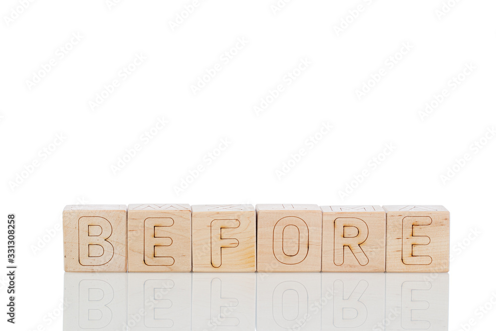 Wooden cubes with letters before on a white background
