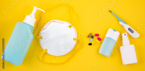 Mask for wearing germ protection Coronavirus or covid19 and gel alcohol or hand sanitizer bottle for washing hand, fever monitor for doctor and hospitals in isolated on white with Clipping Path.