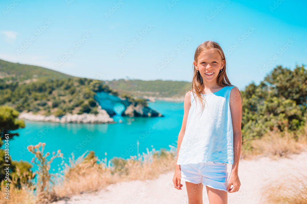 Little girl on vacation travel background beautiful landscape Little girl on vacation travel background beautiful landscape