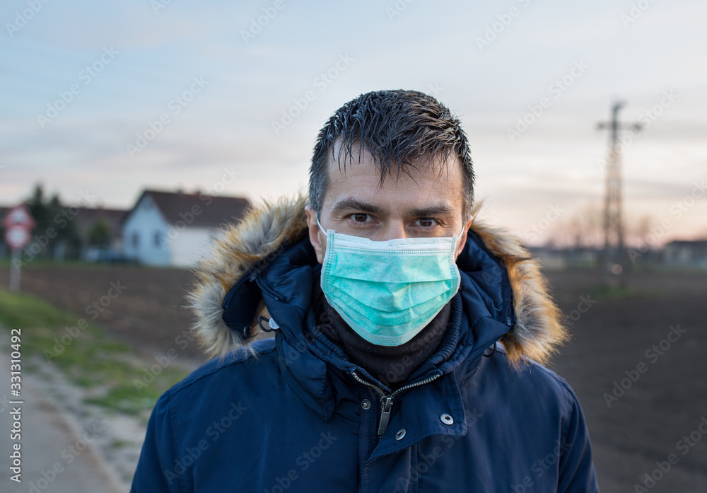 Man with protective mask walking outside Man with protective mask walking outside