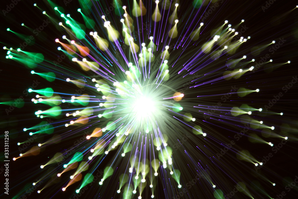Naklejka premium Abstract fibre optic light patterns created using the zoom blur technique