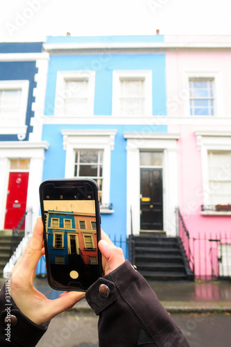 Closeup of a smartphone photo of colored house in Notting Hill