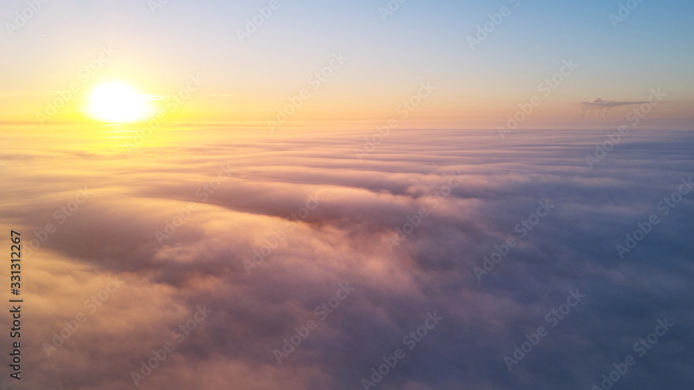 Sunrise above clouds