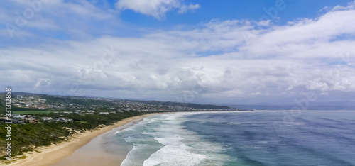Panoramic view of the gorgeous Plettenberg Bay beach and town from the peninsula of the Robberg Nature Reserve
