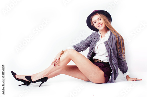young pretty teenage girl in hat posing cheerful happy smiling on white background isolated, lifestyle people concept © iordani