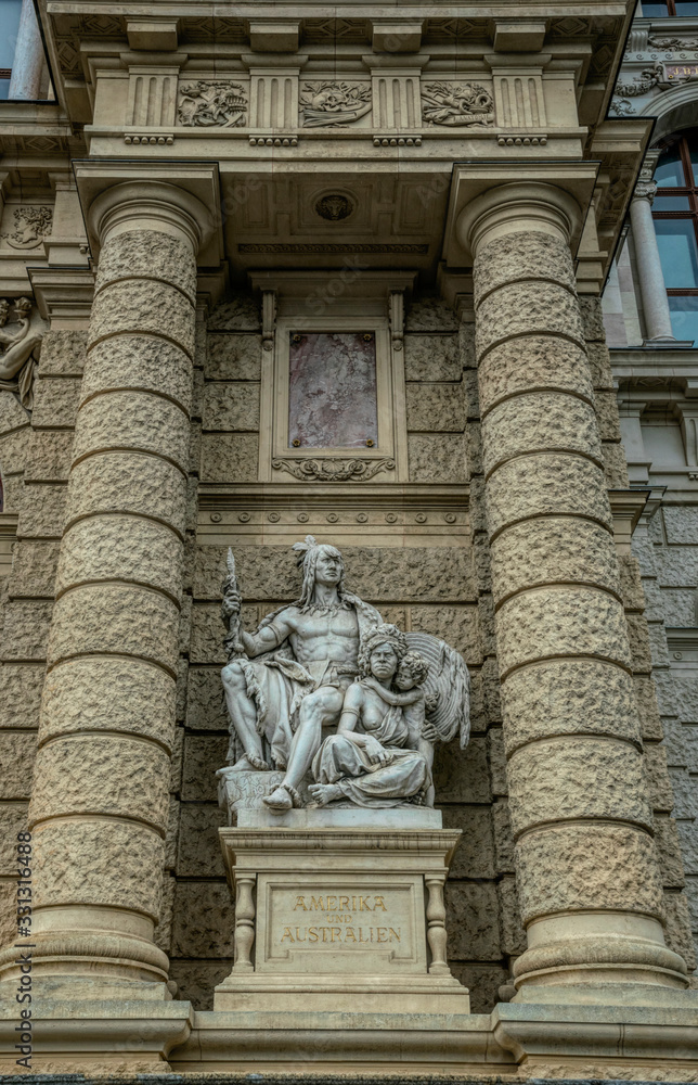 Decorative marble sculptures and columns on the facade of the building of the National Museum of Natural History in the building of the Hofburg Palace in Vienna, Austria Decorative marble sculptures and columns on the facade of the building of the National Museum of Natural History in the building of the Hofburg Palace in Vienna, Austria