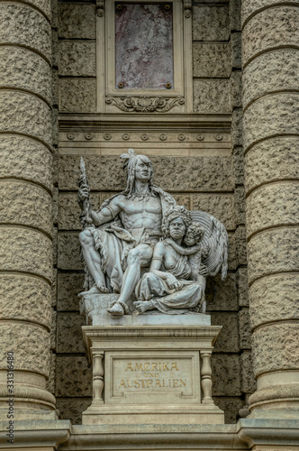 Decorative marble sculptures and columns on the facade of the building of the National Museum of Natural History in the building of the Hofburg Palace in Vienna, Austria