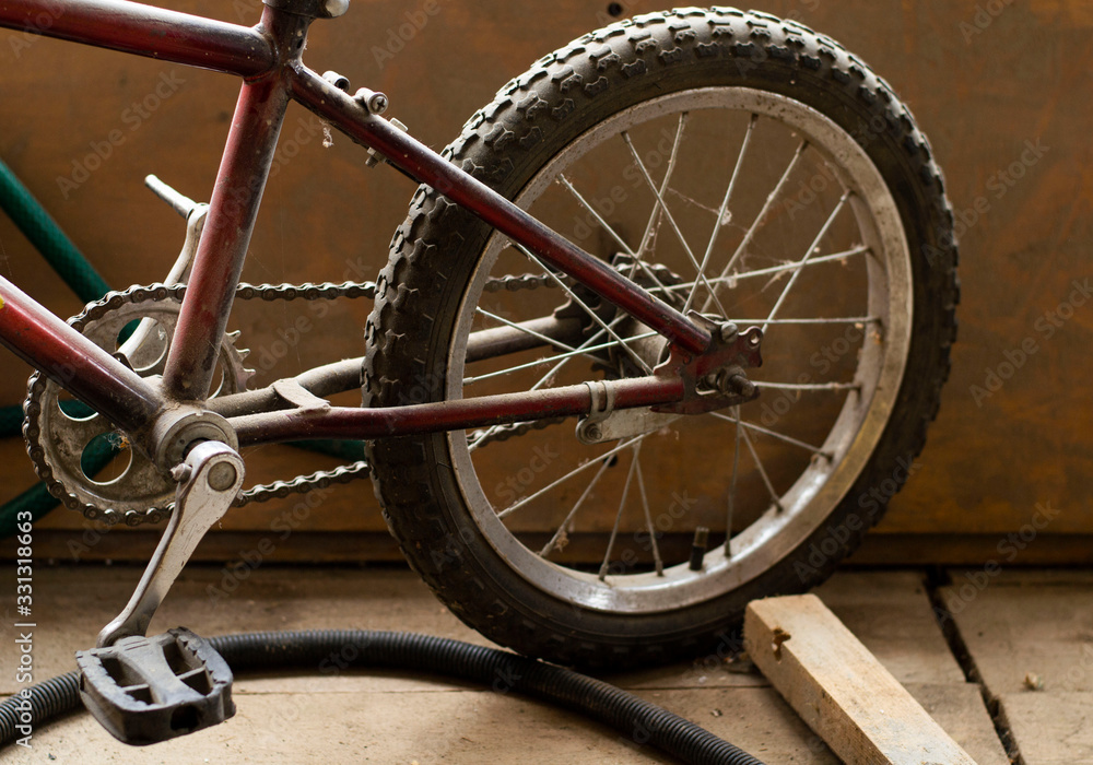wheel with a chain of an old children's bike. wheel with a chain of an old children's bike.