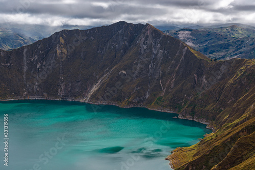 The highest peak of the Quilotoa Loop at 3914 meters high with the turquoise colors of the crater lagoon in the Andes mountain range, south of Quito, Ecuador. 