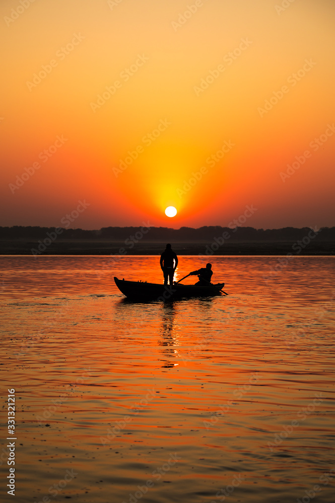 Rowing boat during Ganges sunrise