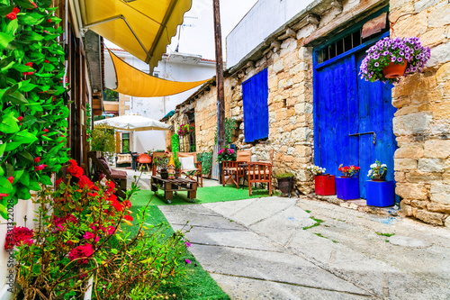 Fototapeta Naklejka Na Ścianę i Meble -  Charming streets with cute cafe bars in old traditional villages of Cyprus island