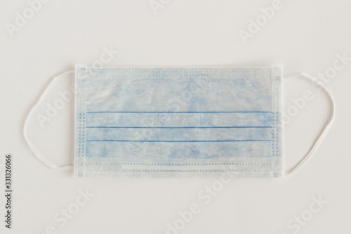 Three ply structure,single use hygenic face mask on white background with copy space.