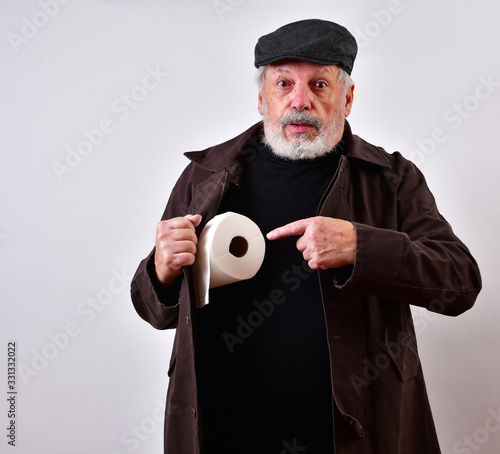 Old man in a trench coat is offering to sell toilet paper at exorbitant prices..Coronavirus panic buying, black market selling of toilet paper