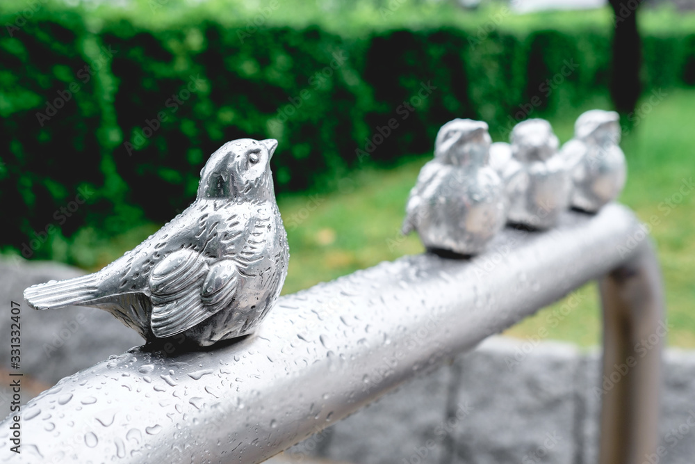 Bird metal sculpture under rain, Osaka, Japan Bird metal sculpture under rain, Osaka, Japan