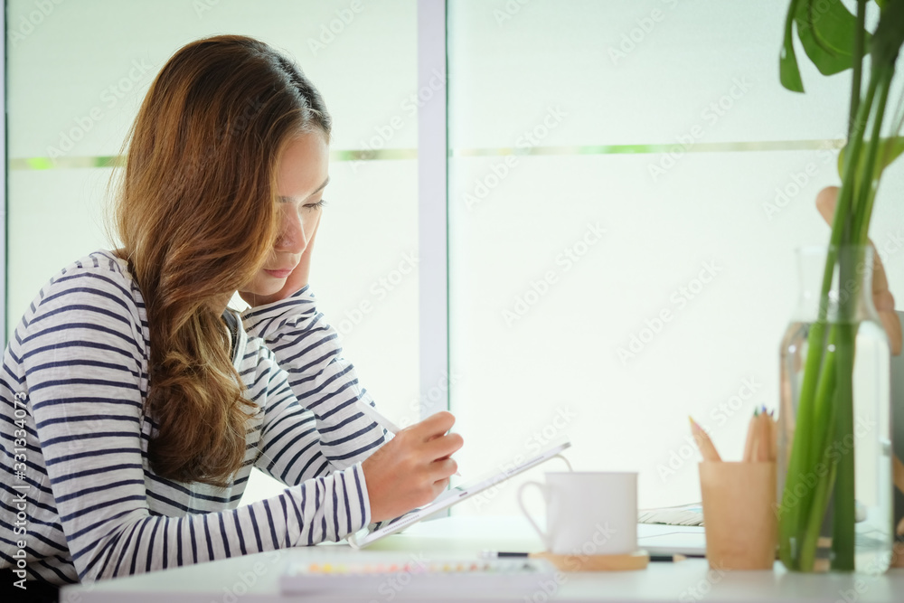 Business woman working in home living room enjoying sunny morning on the day with documents and laptop people Consulting and business planning. Business woman working in home living room enjoying sunny morning on the day with documents and laptop people Consulting and business planning.