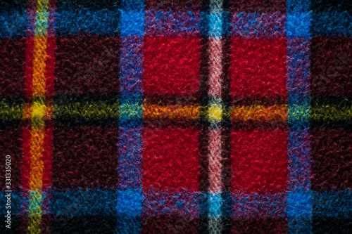 Wool plaid scotch blanket background flat laydown top view and detailed taken.