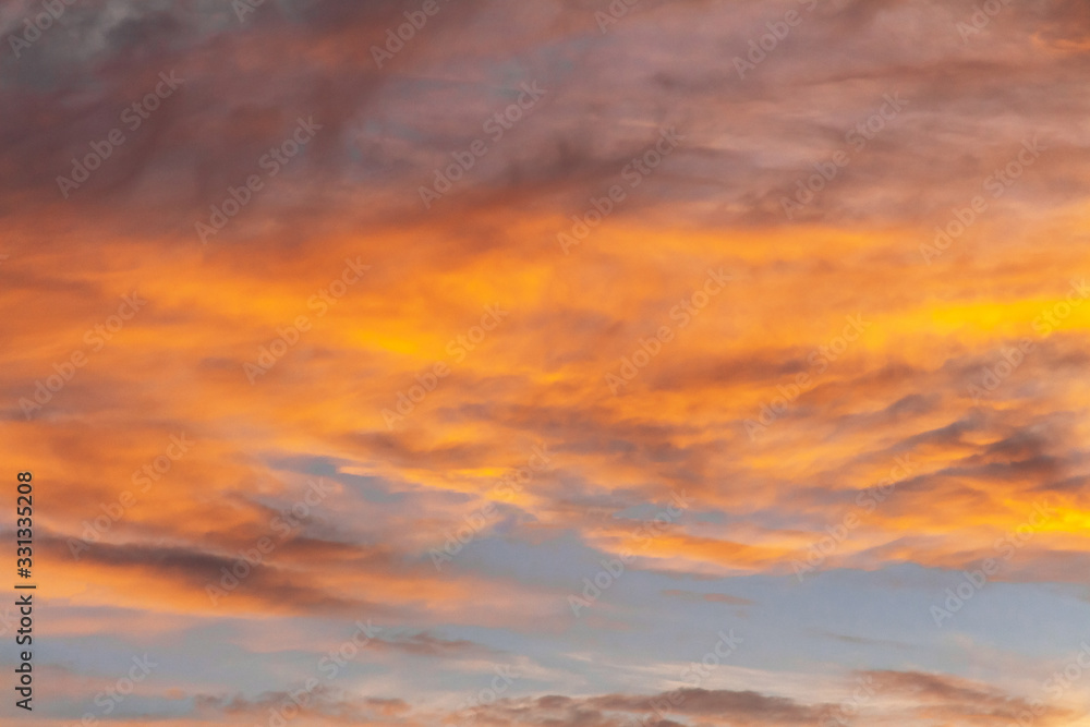 Fototapeta premium Colorful dramatic sky at sunset with pasted clouds