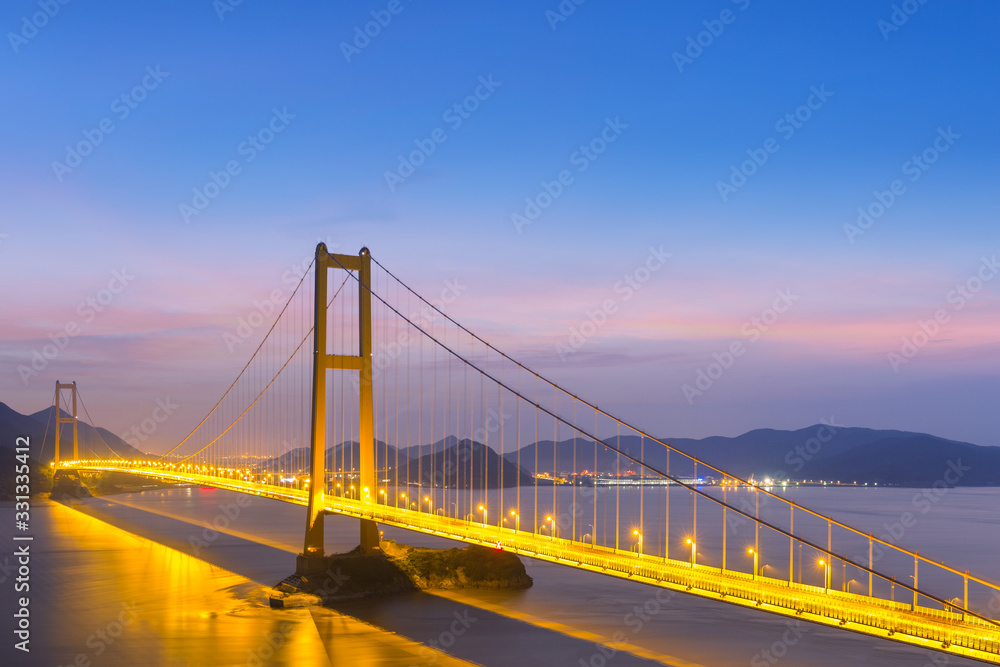 modern suspension bridge in nightfall