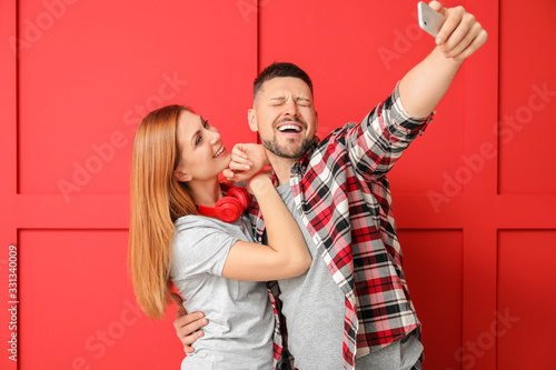 Couple taking selfie on col...