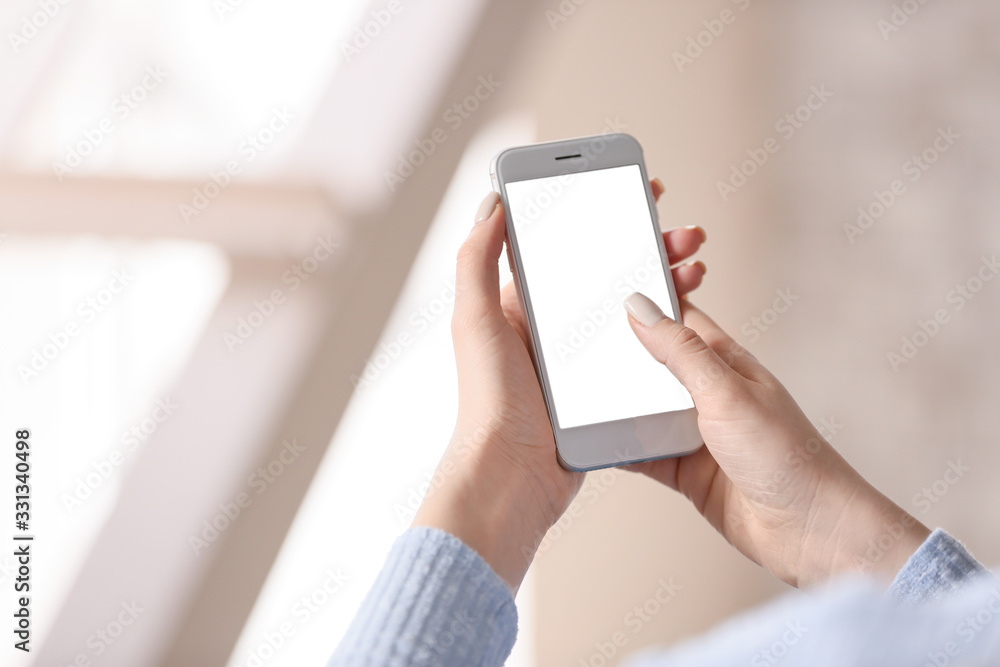 Young woman with mobile phone at home Young woman with mobile phone at home