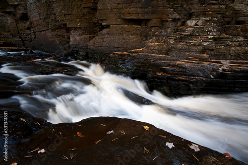 The Sturgeon River flows between steep canyon walls just downstream from Canyon Falls in Michigan s Upper Peninsula.