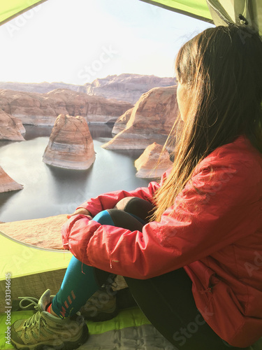 Woman backpacking camping at Reflection Canyon in Utah USA