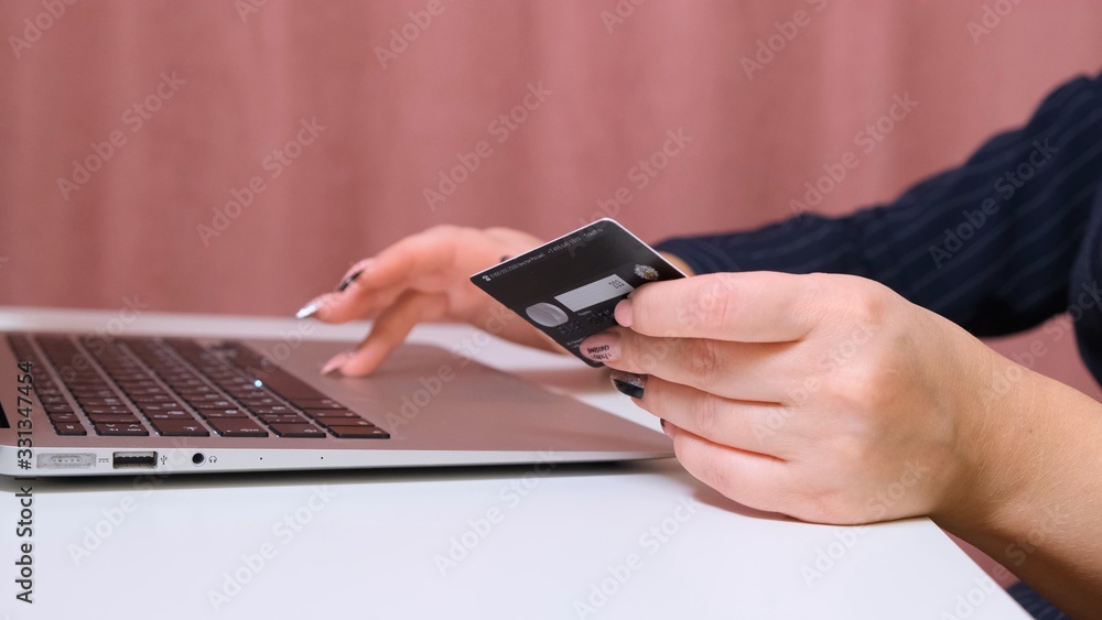 woman makes bargains through the internet, close-up. woman makes bargains through the internet, close-up.