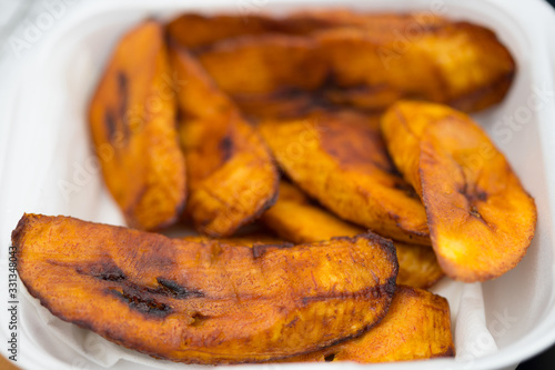 Sweet ripe fried plantains in selective focus, breakfast