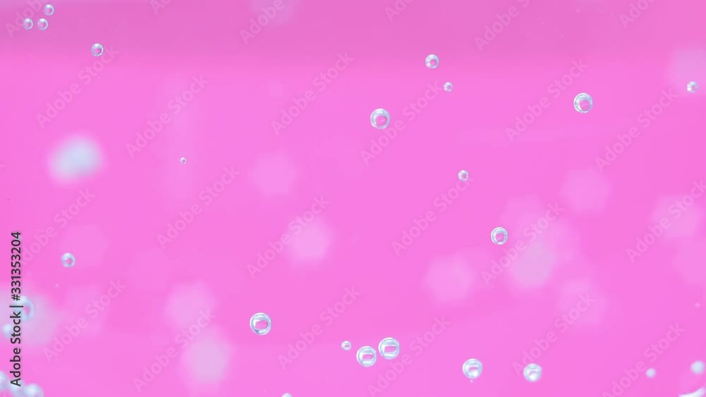 pink glass background with drops of water, soda. mineral water close up selective focus pink glass background with drops of water, soda. mineral water close up selective focus