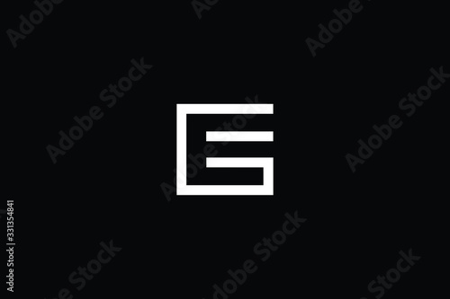 Minimal elegant monogram art logo. Outstanding professional trendy awesome artistic GE EG initial based Alphabet icon logo. Premium Business logo White color on black background photo