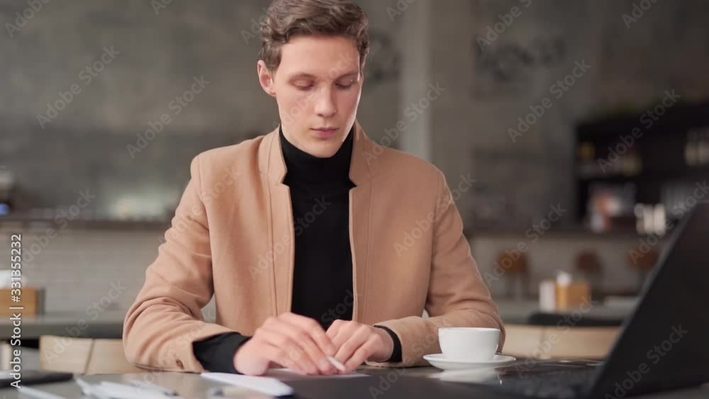 guy draws sketches of laptop in cafe guy draws sketches of laptop in cafe