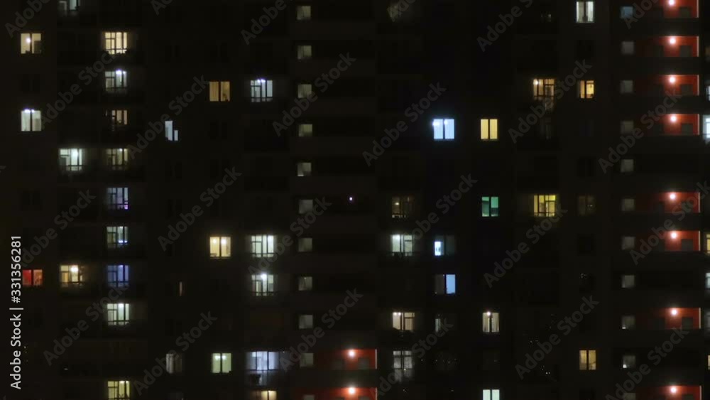 Window lights of a building in time-lapse Window lights of a building in time-lapse