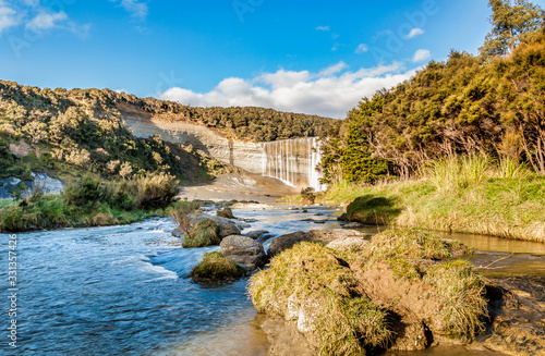 Walking up the river through the valley to the base of the spectacular block waterfall Mangatiti falls at  Pongaroa Wairarapa New Zealand