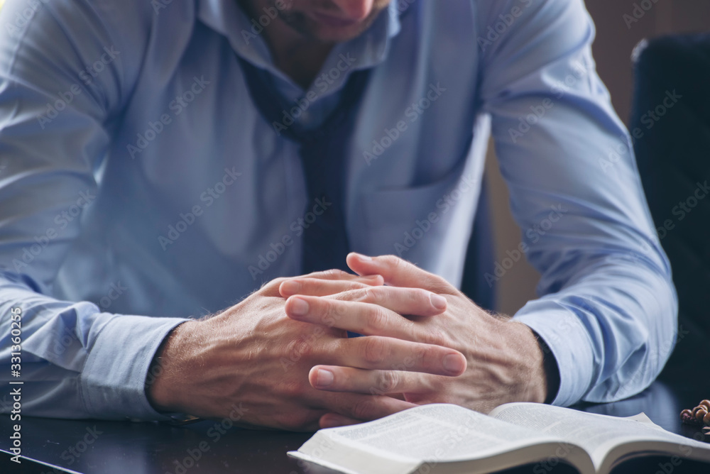 Obraz premium Pray and bible concept.Caucasian male praying,hope for peace and free from disease,Hand in hand together on bible by woman,believes and faith in christian religion at church.