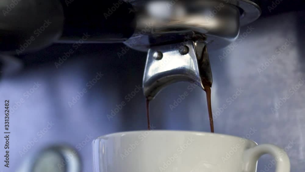 Low Angle Macro Close Up Shot of coffee stream from Filter Holder Low Angle Macro Close Up Shot of coffee stream from Filter Holder