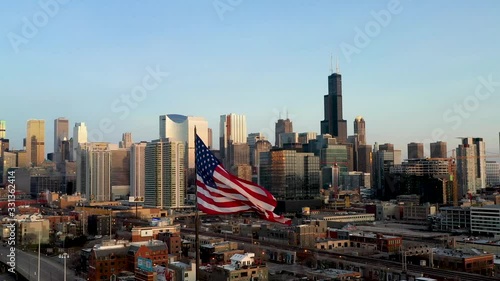 Chicago Cityscape and American Flag Waiving in the Wind