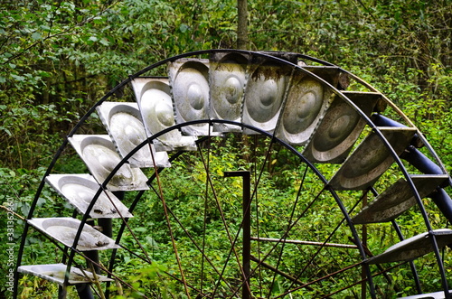 Design of water wheel with blades for water pumping. photo