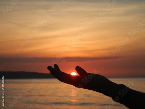 Palm of the hand in the sunset