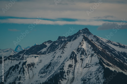 Beautiful mountain panorama from Leysin range on a cloudy winter day. Looking towards mountains at Les Diablerets. © Anze