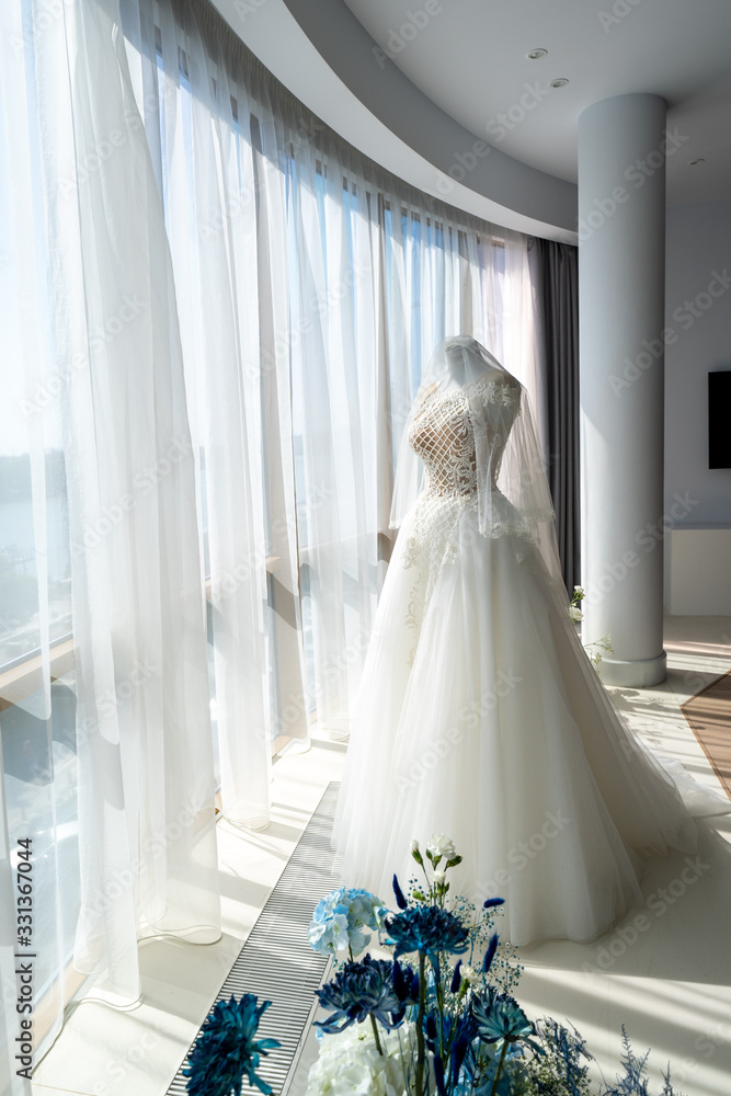 wedding dress on a mannequin in panorama window. wedding dress on a mannequin in panorama window.