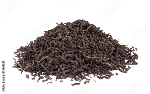 Dry black tea leaves isolated on white background