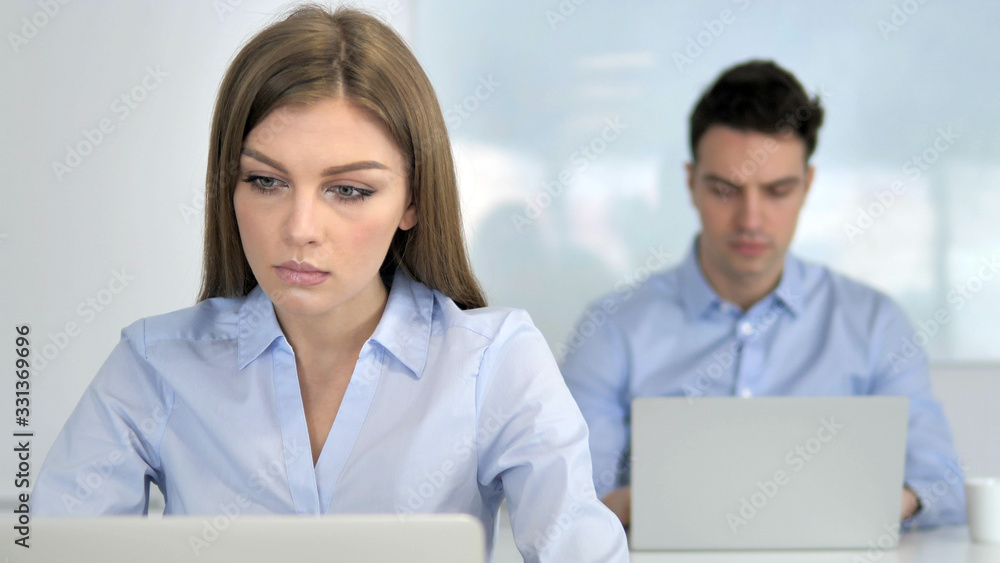 Young Businesswoman Working on Laptop in Office Young Businesswoman Working on Laptop in Office