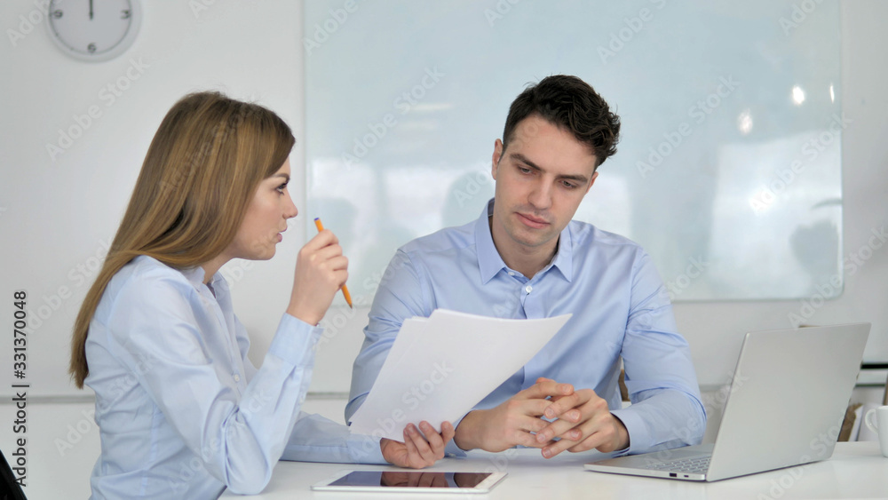 Obraz premium Business People Discussing Project Documents, Paperwork