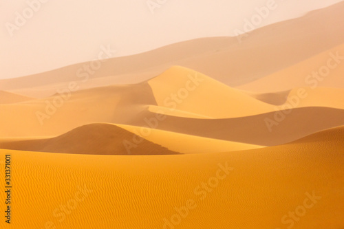 Fototapeta Naklejka Na Ścianę i Meble -  Desert Sahara with beautiful lines and colors at sunrise. Merzouga, Morocco