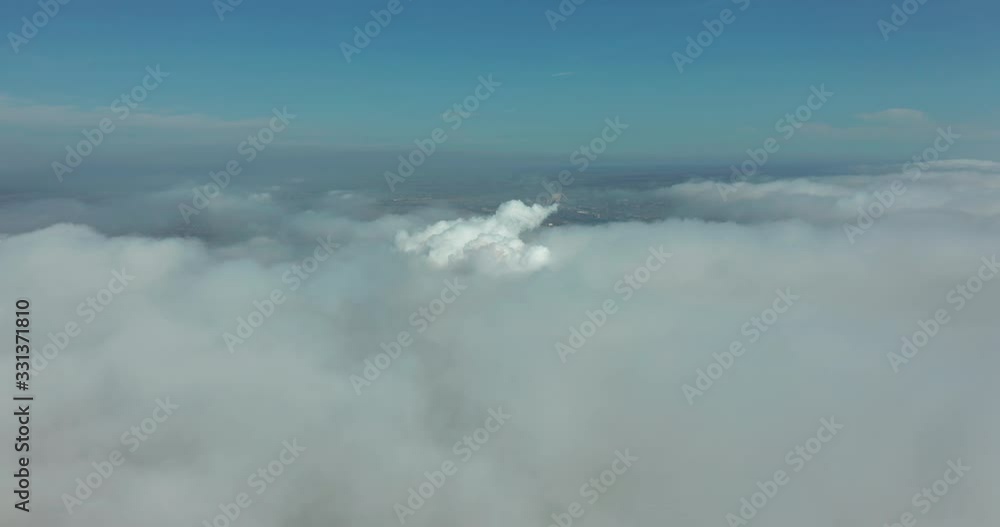 Aerial view. Scenic aerial view through moving white clouds. Fog. Aerial view. Scenic aerial view through moving white clouds. Fog.