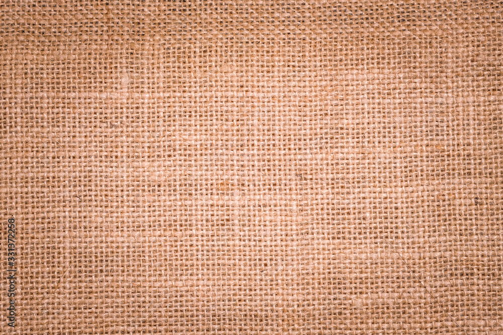 Rough hessian background with flecks of varying colors of beige and brown. with copy space. office desk concept, Hessian sackcloth burlap woven texture background. Rough hessian background with flecks of varying colors of beige and brown. with copy space. office desk concept, Hessian sackcloth burlap woven texture background.