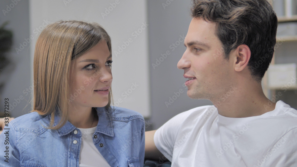 Close up of Talking Young Couple Discussing and Sharing Information Close up of Talking Young Couple Discussing and Sharing Information