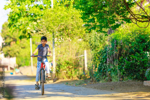indian / Asian little boy enjoy cycle riding © PRASANNAPIX